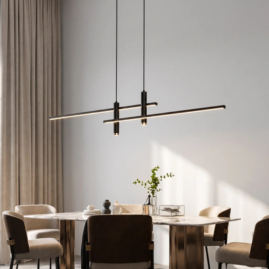 Black linear pendant light suspended above a dining table