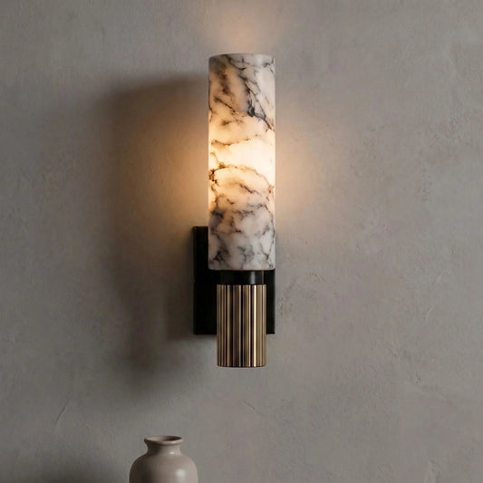 Cylindrical veined wall sconce mounted in an interior
