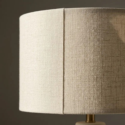 Close-up of the pale cylindrical fabric shade