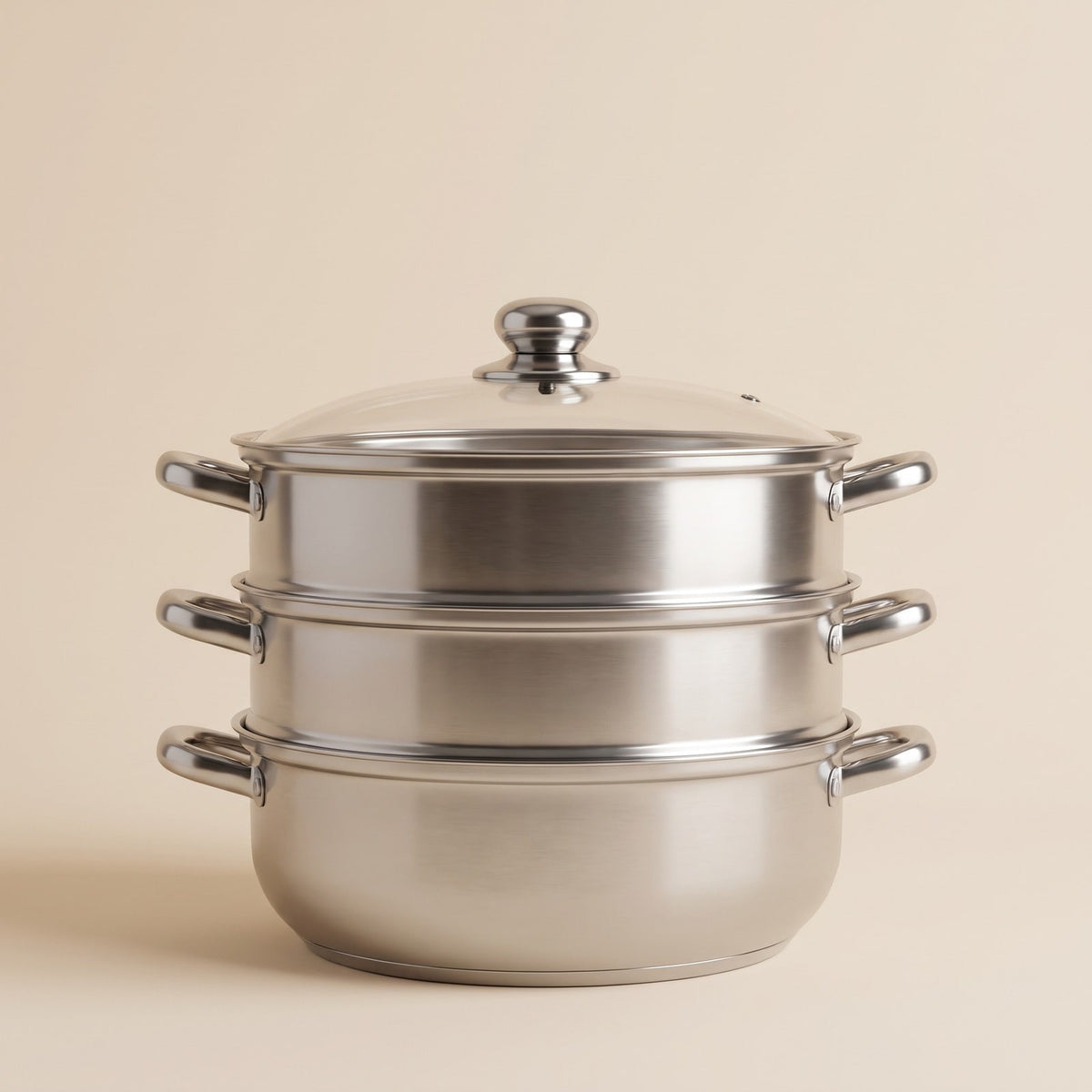 3 tier stainless steel food steamer pot with glass lid on a plain background