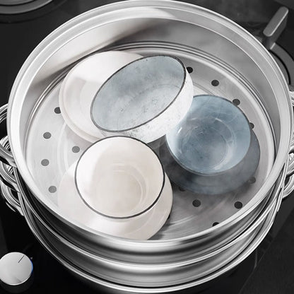 Top view into the perforated steamer tier holding small bowls