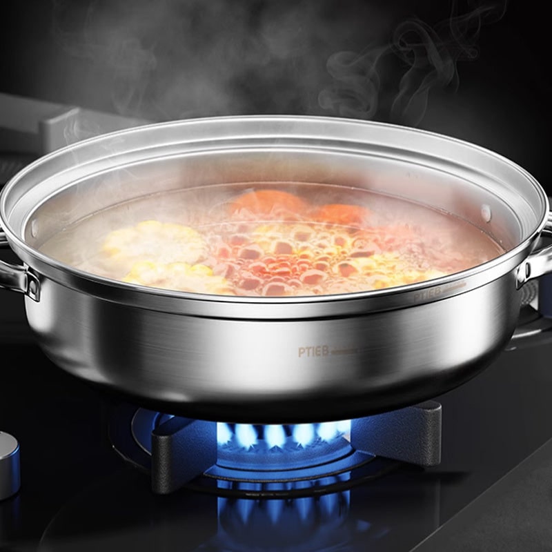 Base pot simmering vegetables on a gas burner