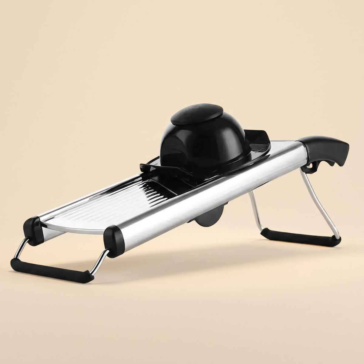 Adjustable stainless steel mandoline slicer with black hand guard on a plain background