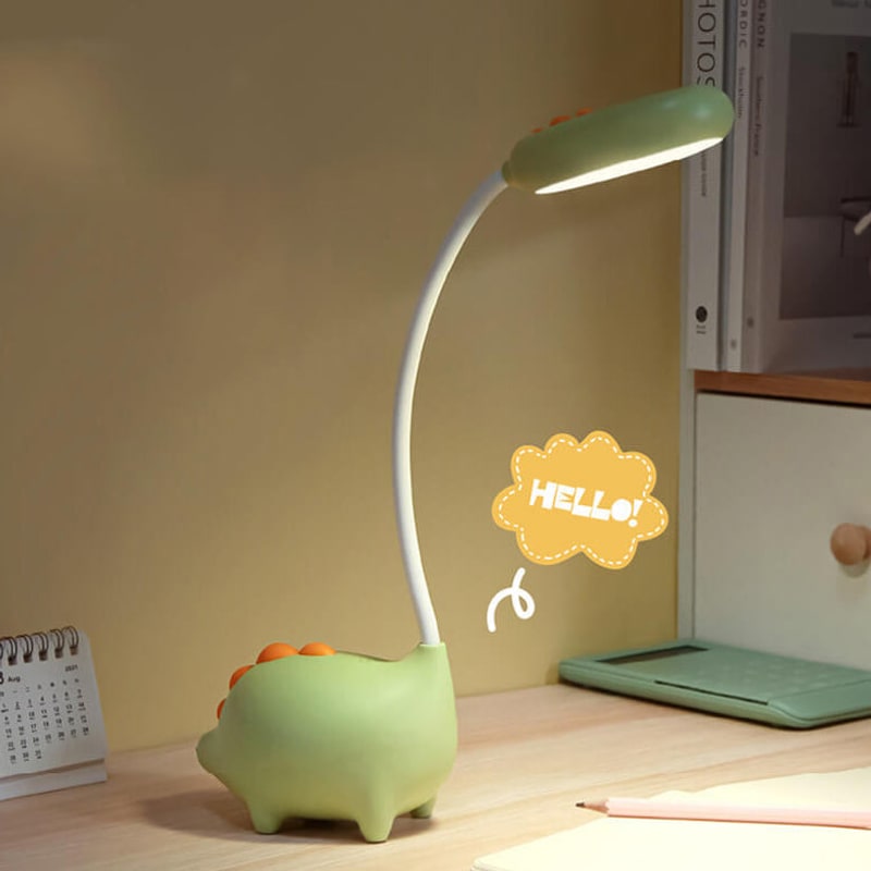 Green lamp next to books