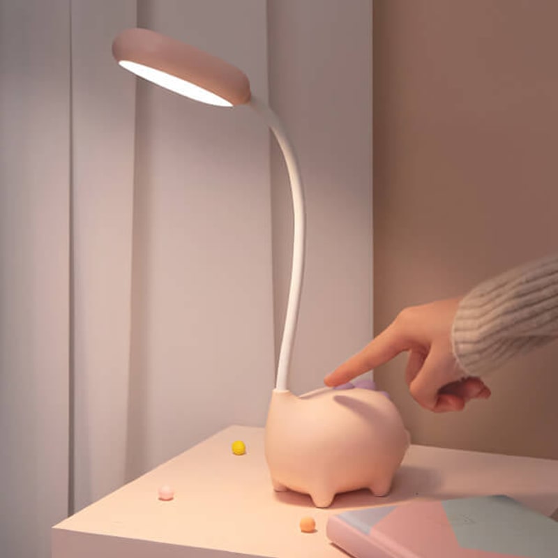 Pink lamp lighting a notebook