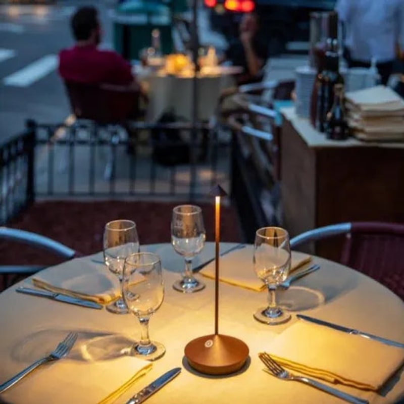 Slim lamp on an outdoor dining table