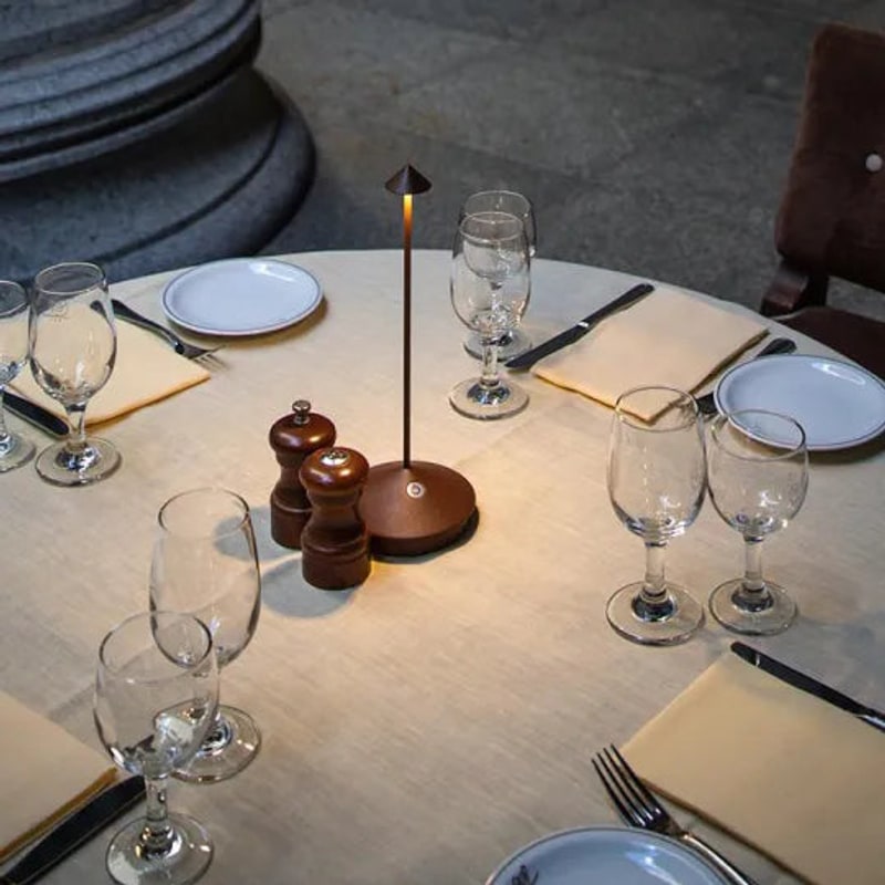 Lamp glowing on a set table