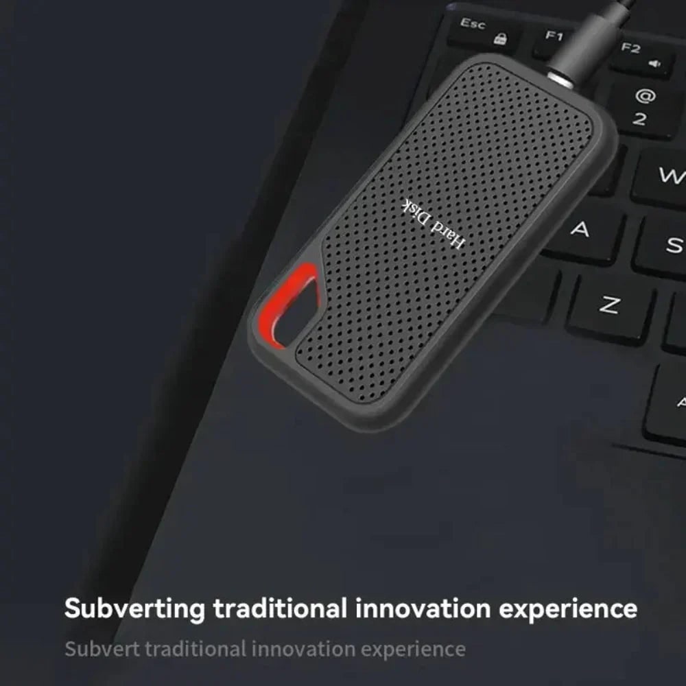 Portable SSD resting on a laptop keyboard