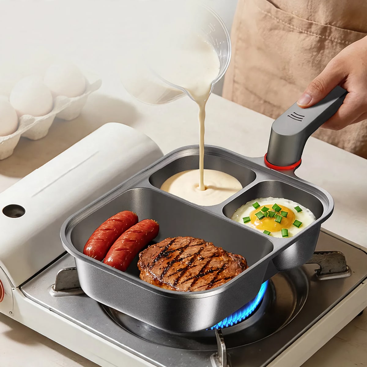 Breakfast pan cooking sausages, steak and eggs