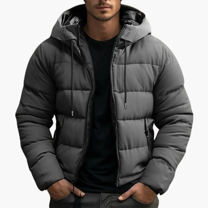 Man wearing a grey hooded puffer jacket