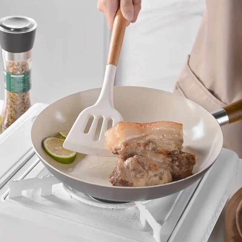 Silicone turner used in a non-stick pan