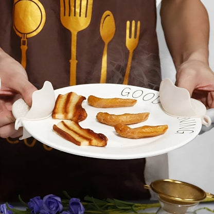 Utensil set on a kitchen counter with a plate