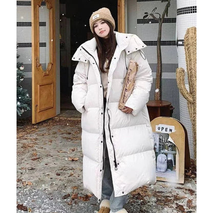 Long hooded puffer jacket styled with boots, front view