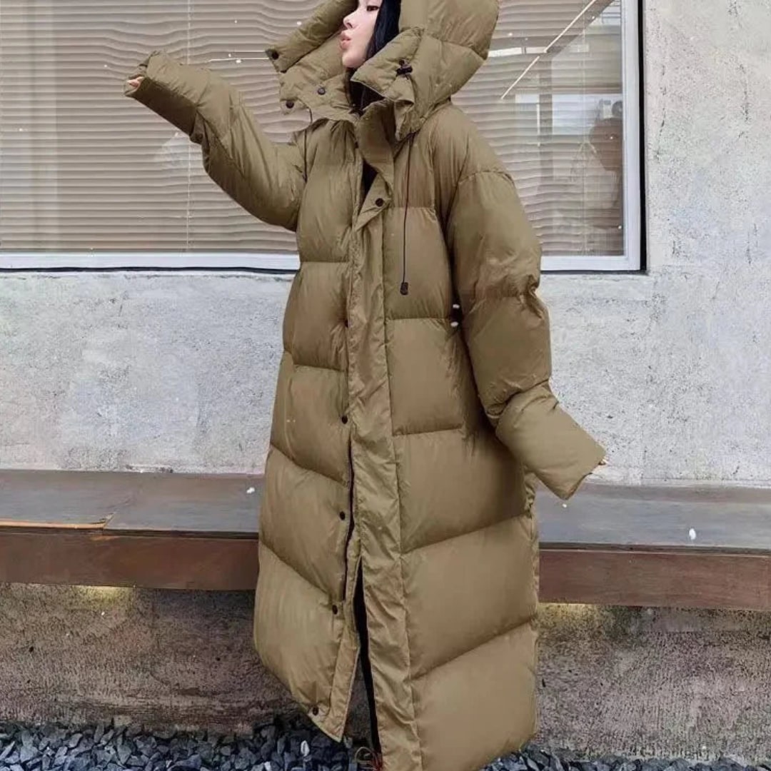Long quilted puffer jacket with hood, side view
