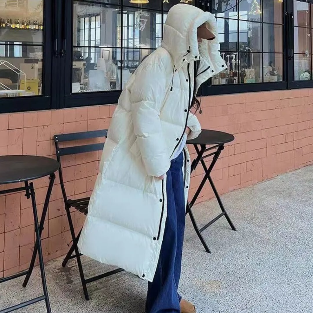 Long hooded puffer jacket worn on a winter day