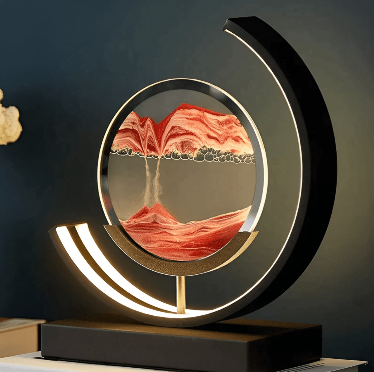 Sand art lamp glowing in a dark room