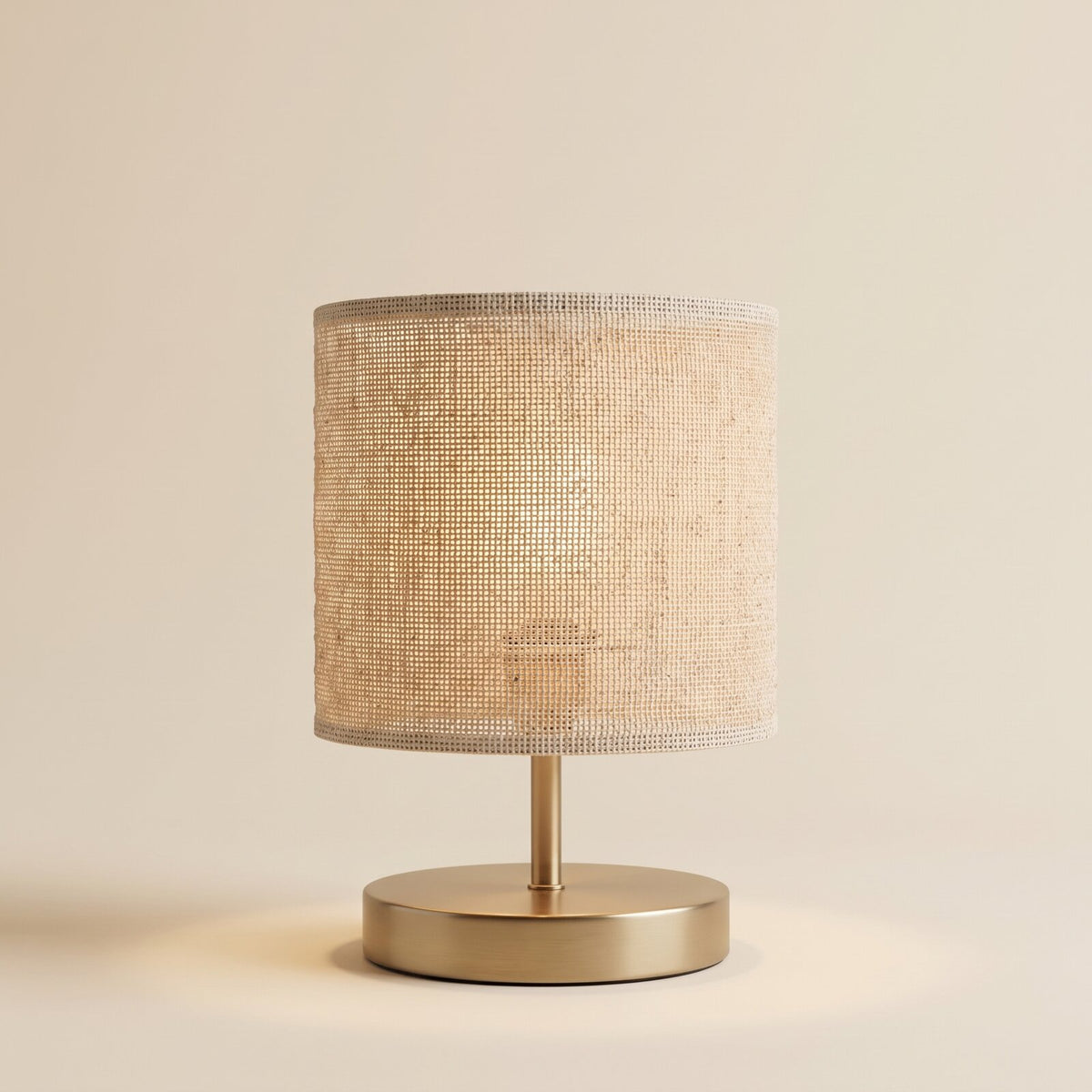 Natural fabric table lamp with brass base