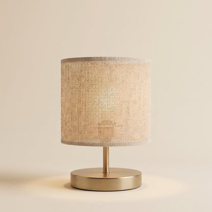 Natural fabric table lamp with brass base