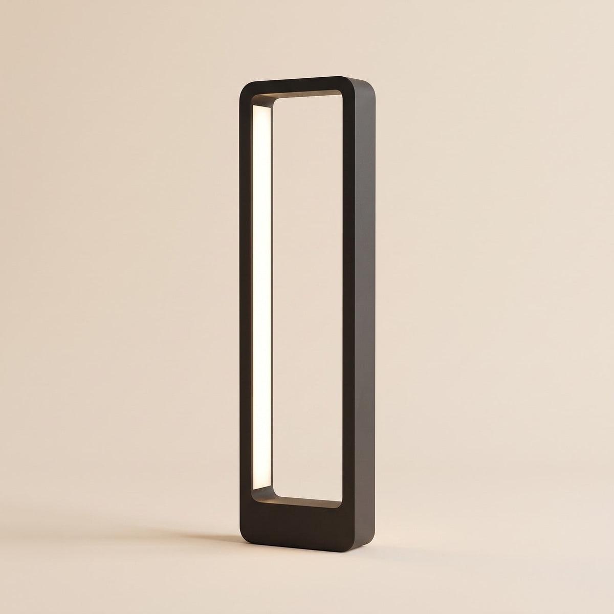 Modern black aluminium LED bollard path light with a warm white light strip