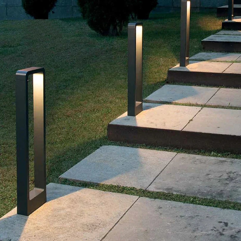 LED bollard path lights placed along garden steps in the evening