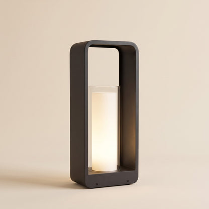 Black aluminium solar lantern with a glowing frosted cylinder