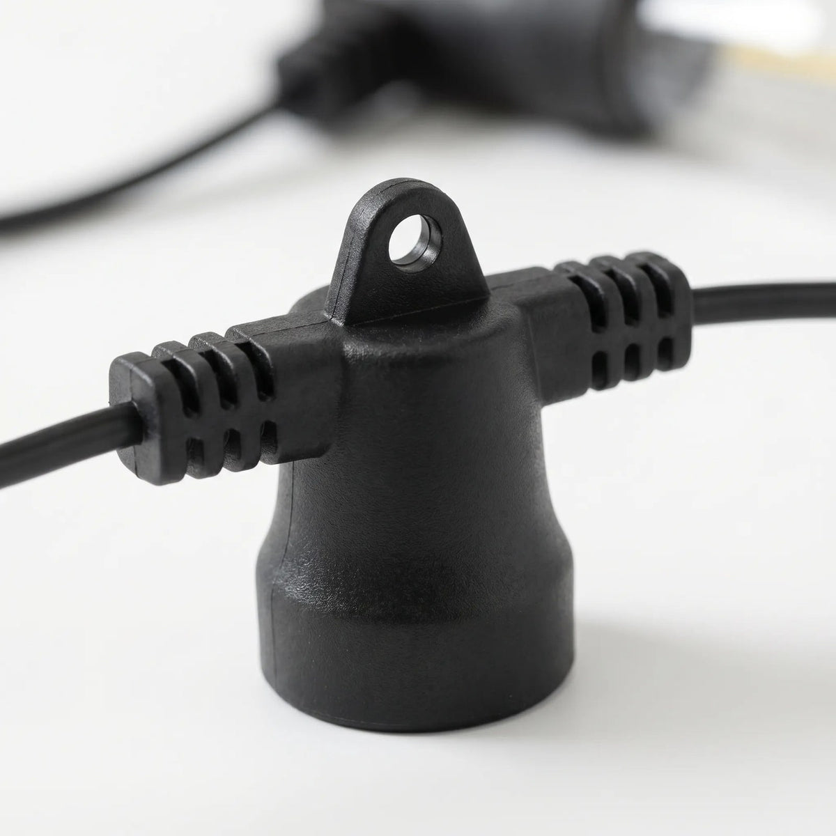 Close up of the black socket with hanging loop and ribbed grips