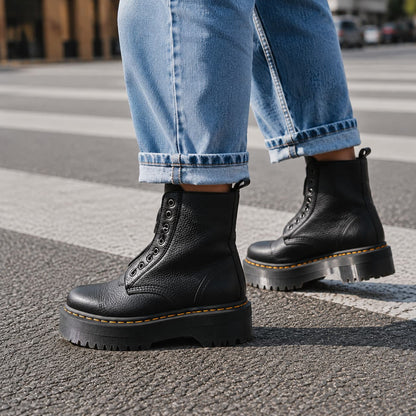 Black platform boots worn with jeans, side view