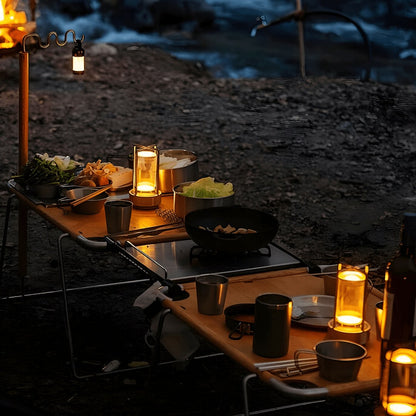 Cordless lantern lamps on an outdoor table at dusk