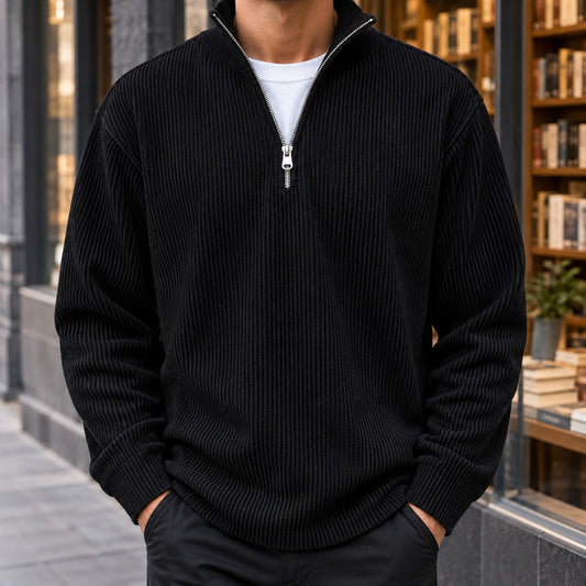 Men's black ribbed quarter zip sweater with a stand collar and metal zip