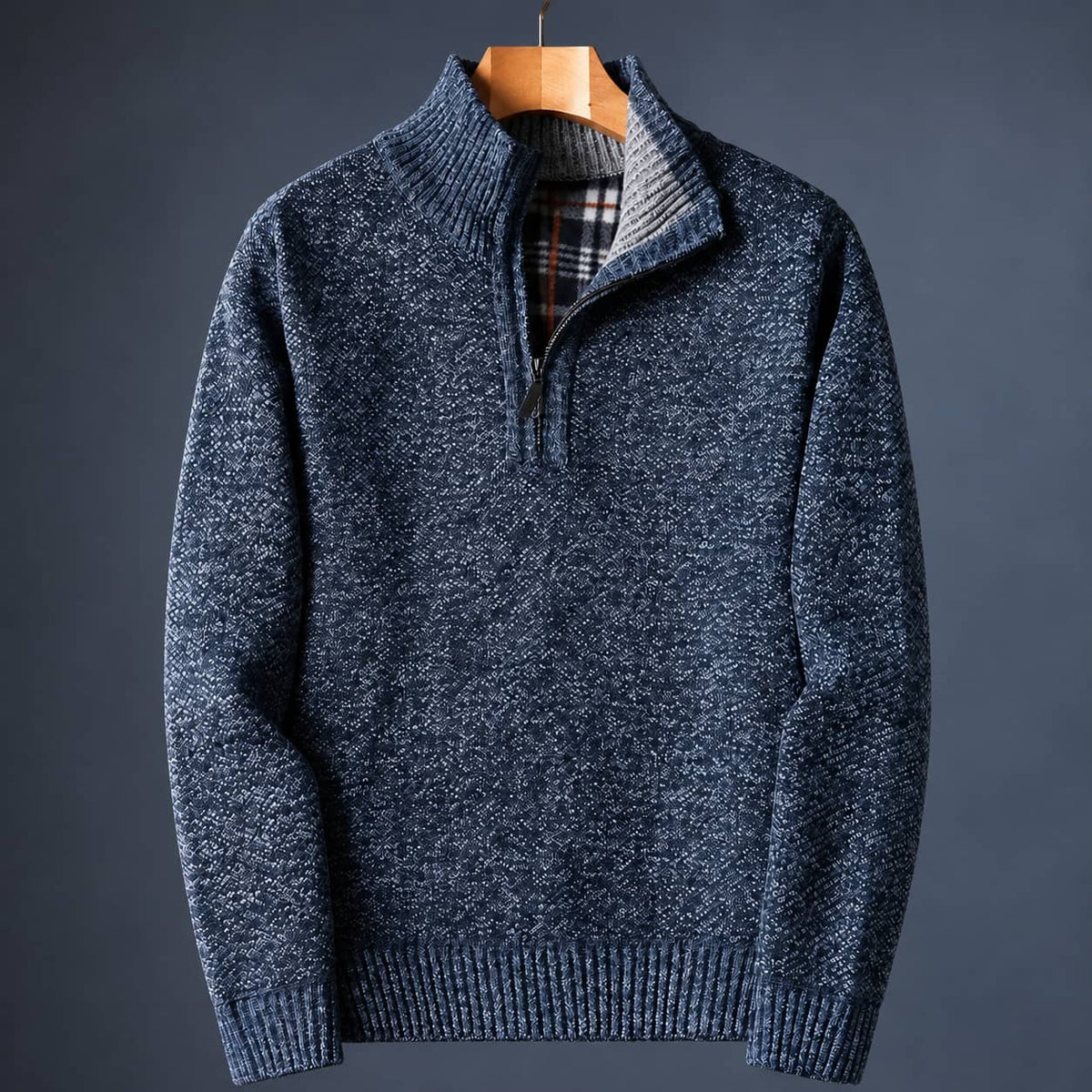 Blue knit quarter zip sweater for men with a mock neck and plaid-lined collar