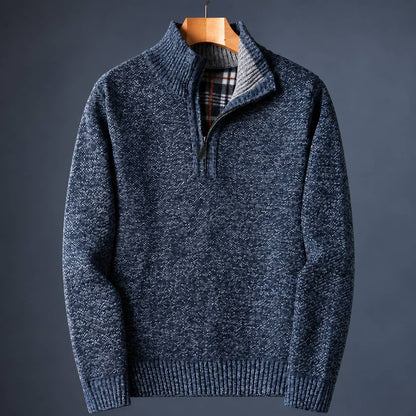 Blue knit quarter zip sweater for men with a mock neck and plaid-lined collar