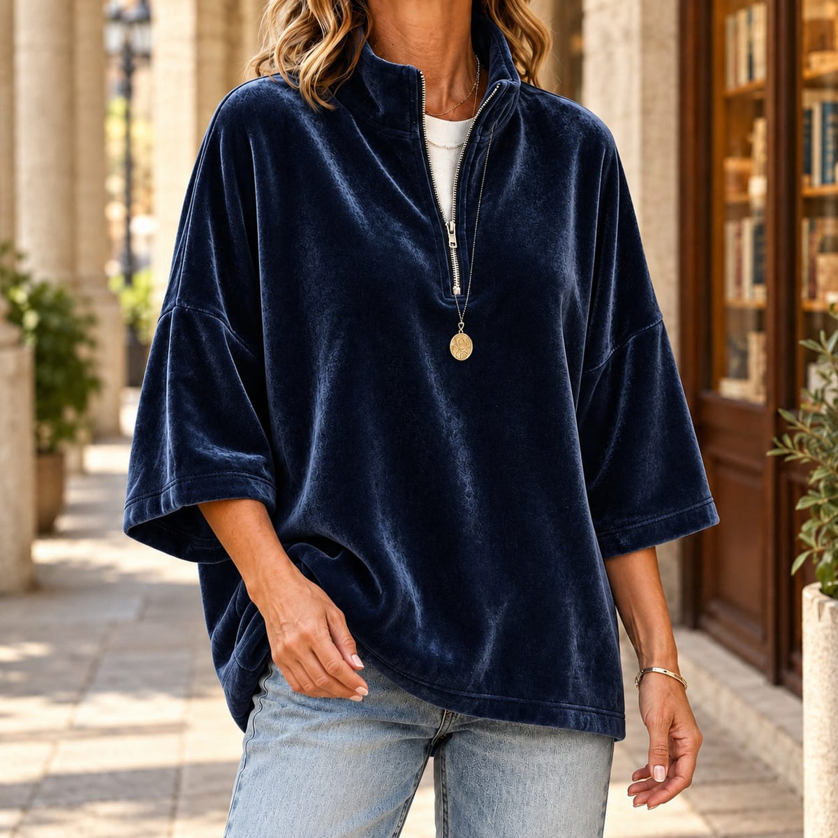 Women's navy quarter zip sweater with a velvety finish