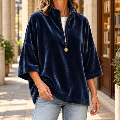 Women's navy quarter zip sweater with a velvety finish