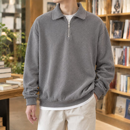 Men's grey quarter zip sweater with a polo collar