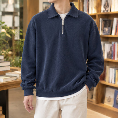 Men's navy quarter zip sweater with a polo collar