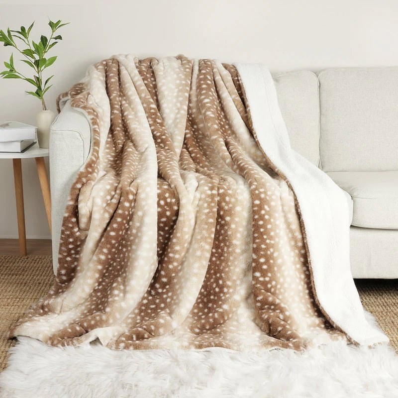 Beige deer print blanket draped over a sofa