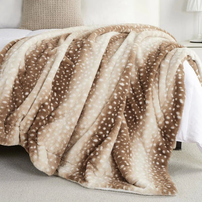 Deer print blanket on a bed