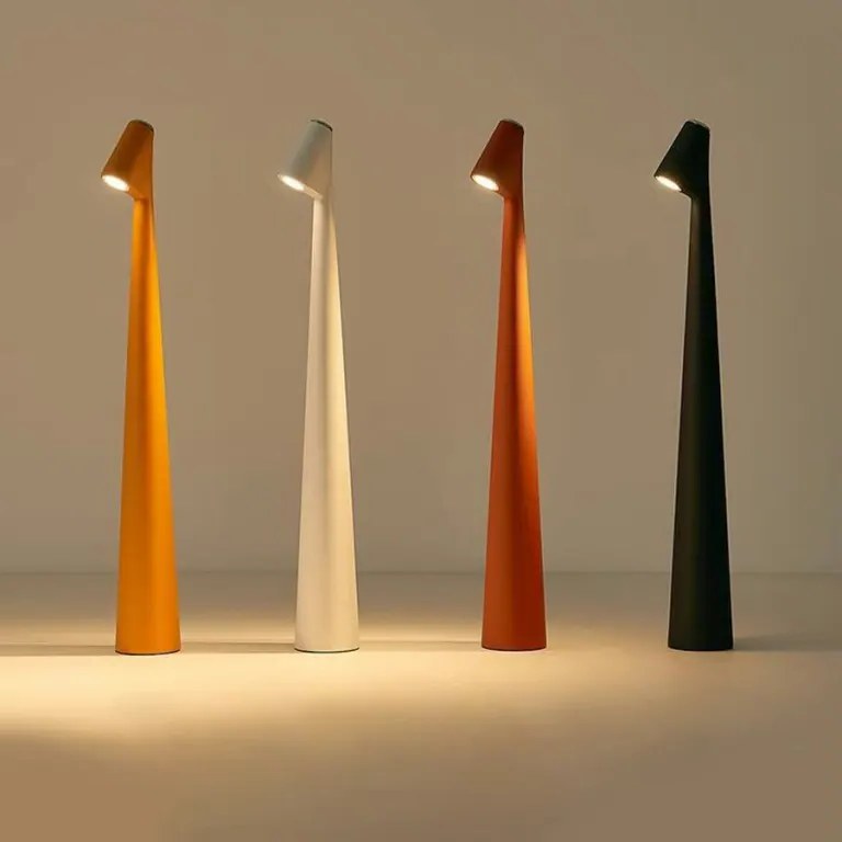 Slim cordless LED table lamps in orange, white, red and black side by side