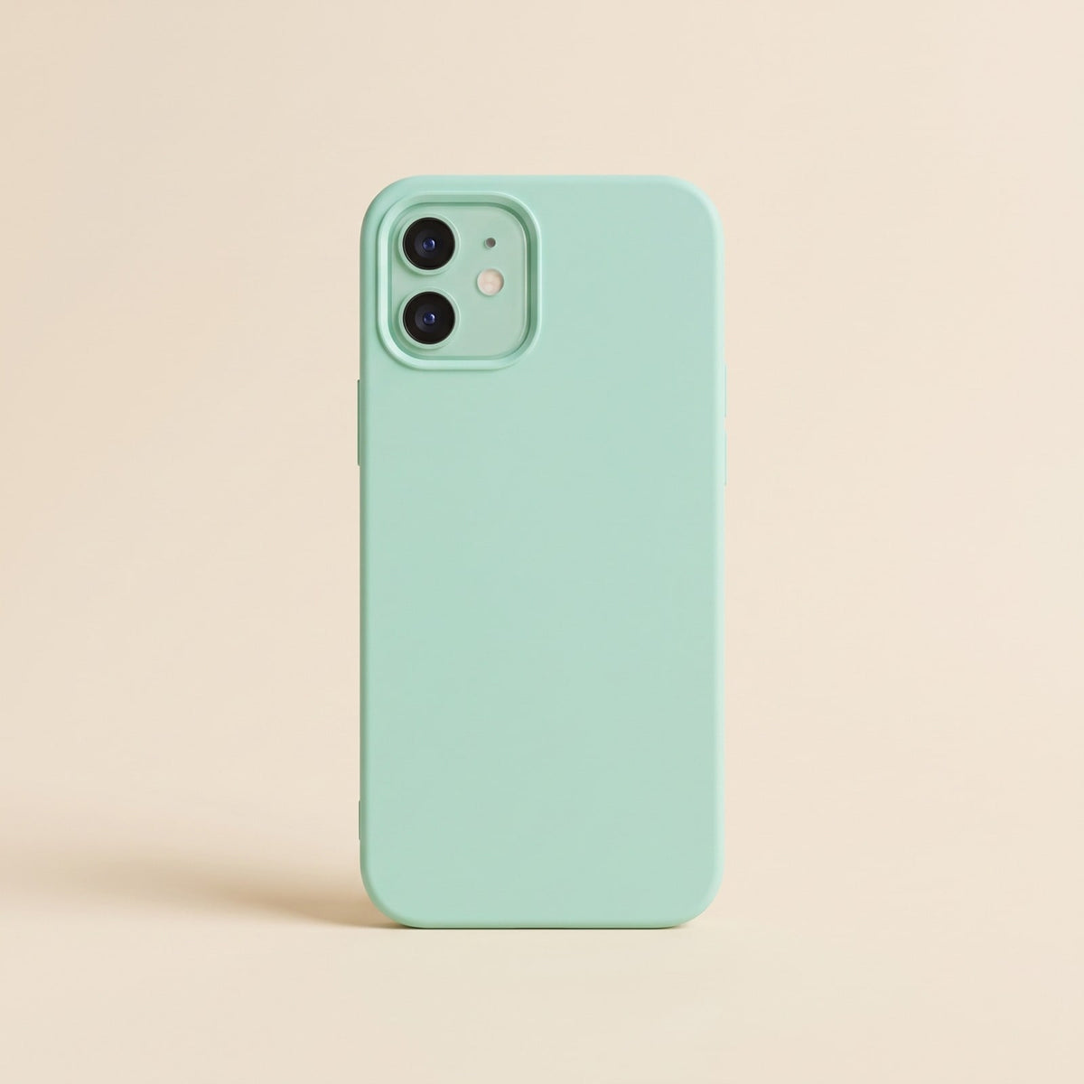 Slim mint green silicone iPhone case with raised camera edge on a plain background