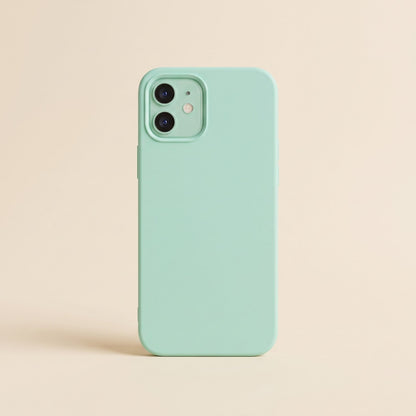 Slim mint green silicone iPhone case with raised camera edge on a plain background