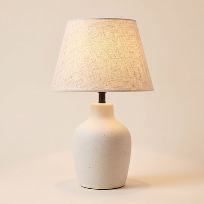 Speckled ivory ceramic table lamp with tapered linen shade