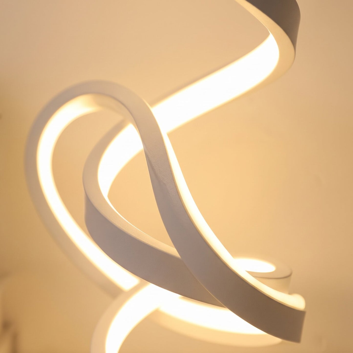 Close-up of the glowing spiral coil of the LED table lamp