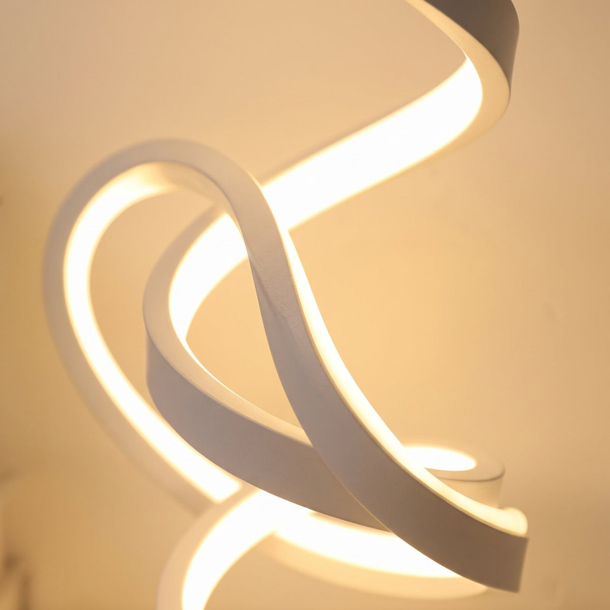 Close-up of the glowing spiral coil of the LED table lamp