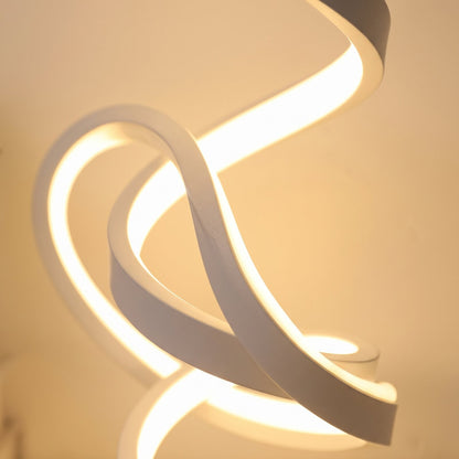 Close-up of the glowing spiral coil of the LED table lamp