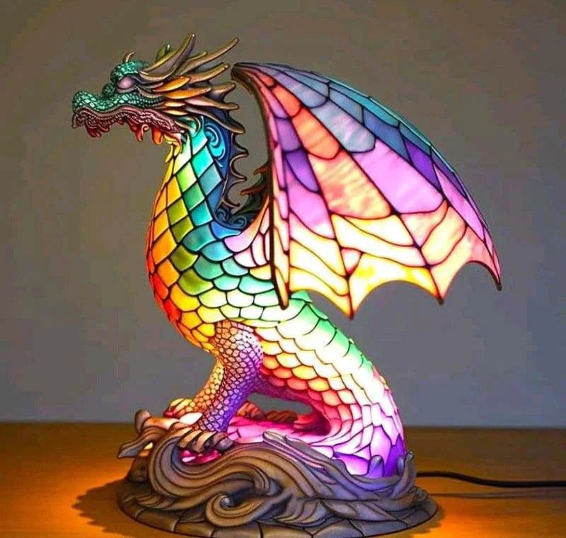 Stained glass dragon table lamp switched on