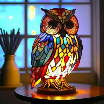 Stained glass owl table lamp switched on