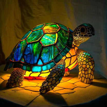 Stained glass turtle table lamp switched on