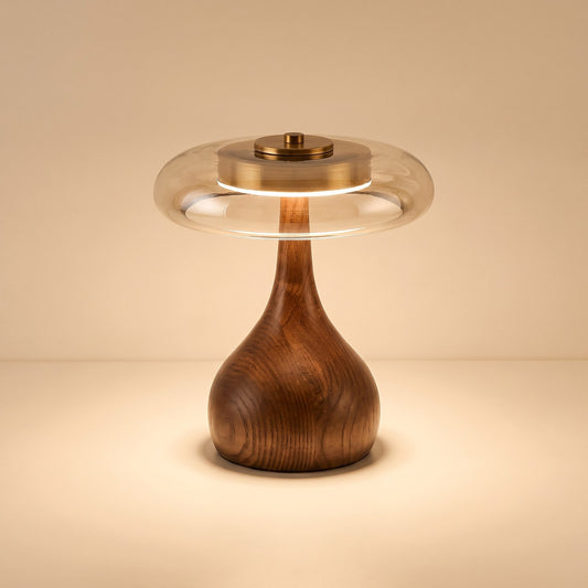 Glass disc LED table lamp with rounded dark wooden base