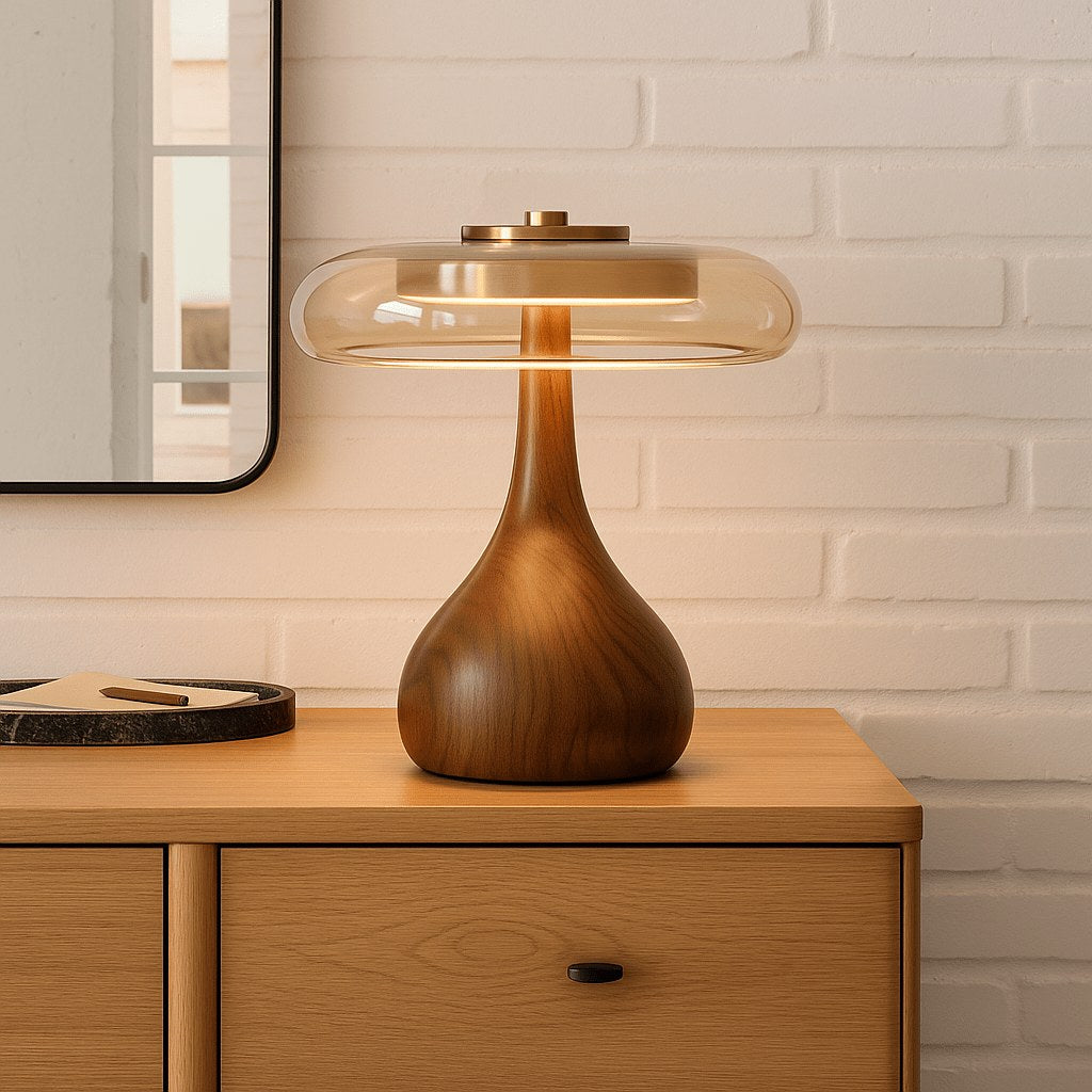 Small glass disc LED table lamp on a dresser