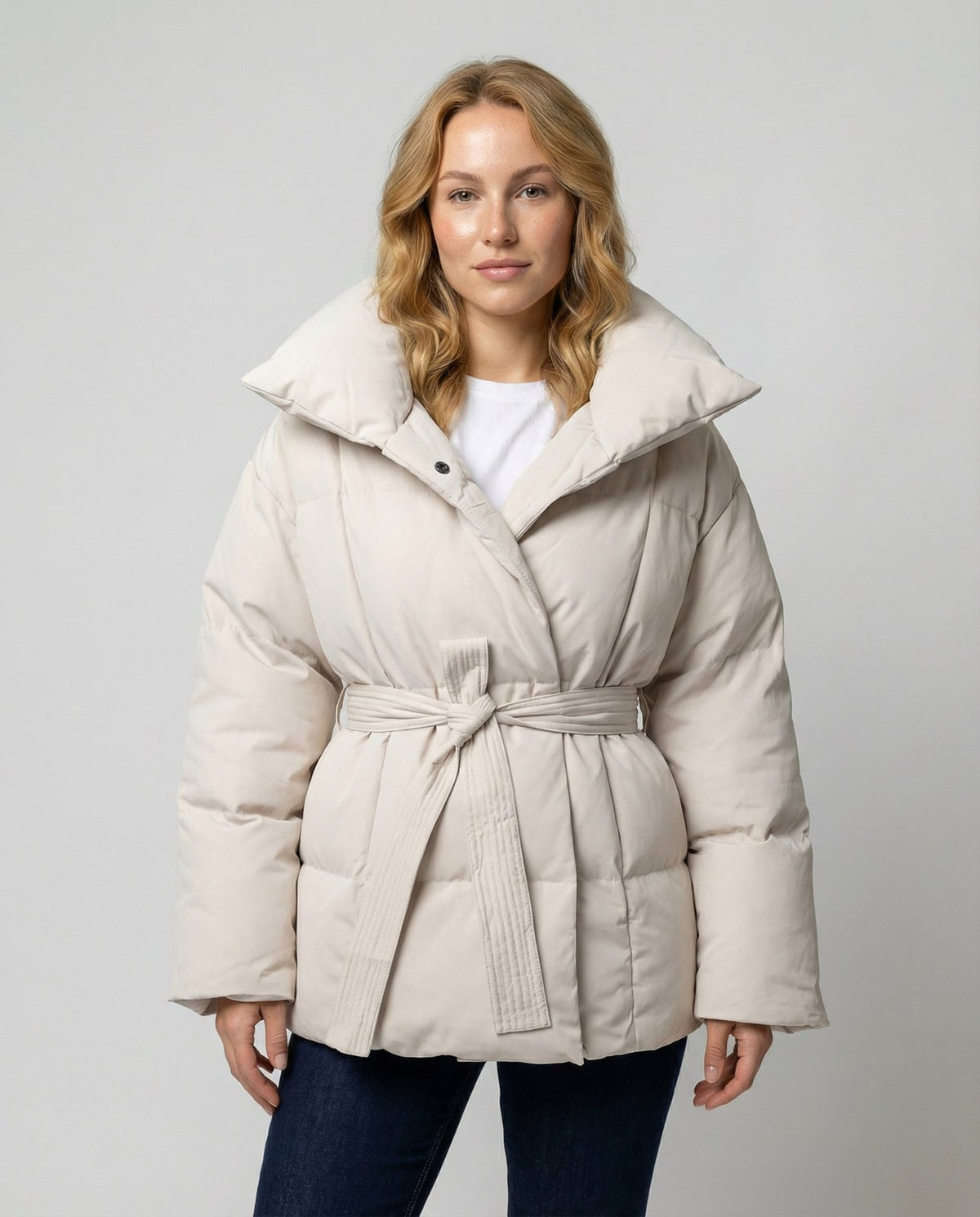 Women's beige fitted winter jacket with belt and stand collar